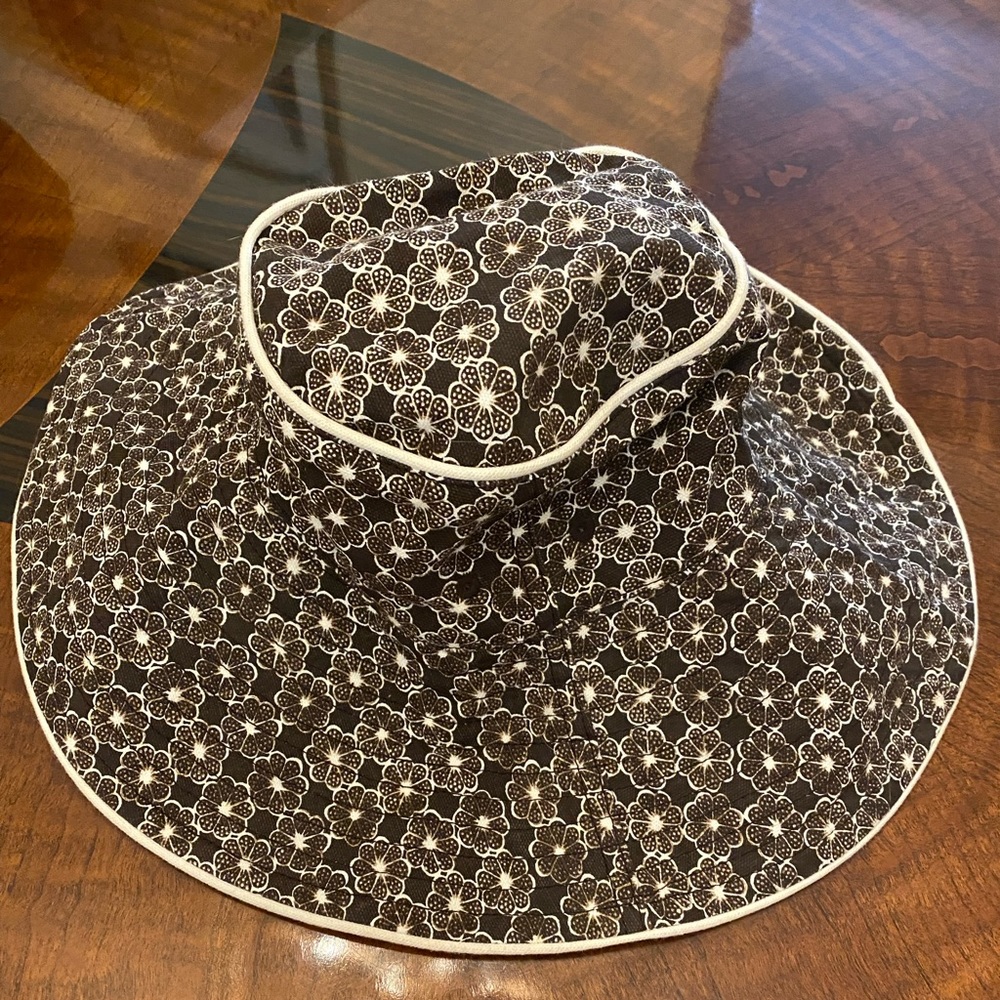 Floppy hat. Brown and white.